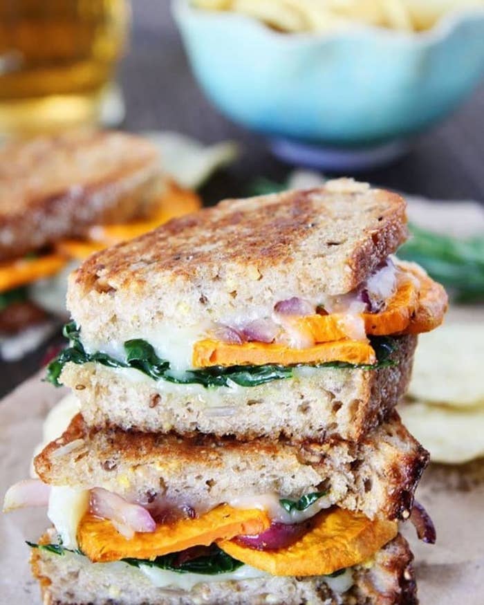 multigrain bread with melted cheese, onions, spinach and sweet potato