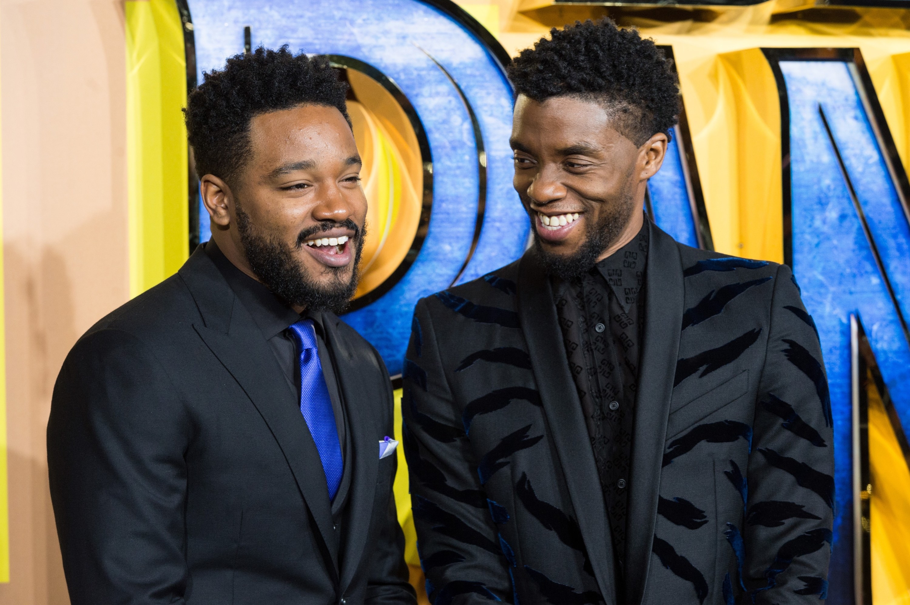 Ryan and Chadwick smiling together at a red carpet event