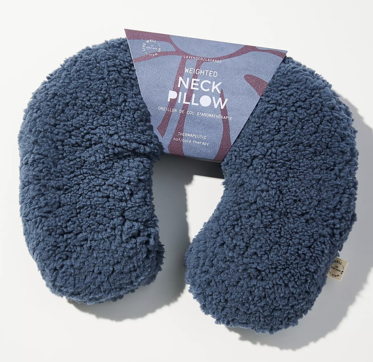 blue weighted neck pillow with sherpa-like texture