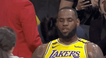 LeBron eating a Twizzler at a basketball game
