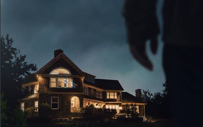 stranger stands outside a home in &quot;the watcher&quot;