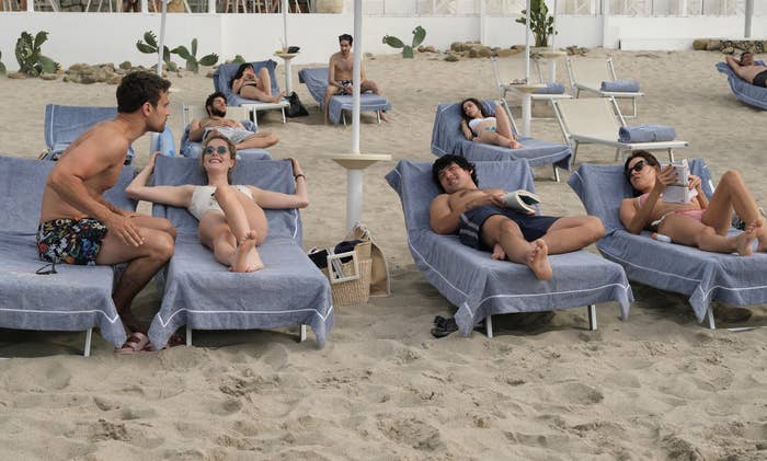 People hang out in beach chairs in Sicily