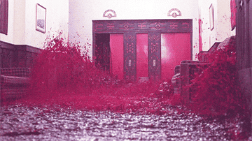 Blood pouring into a hallway in front of hotel elevators