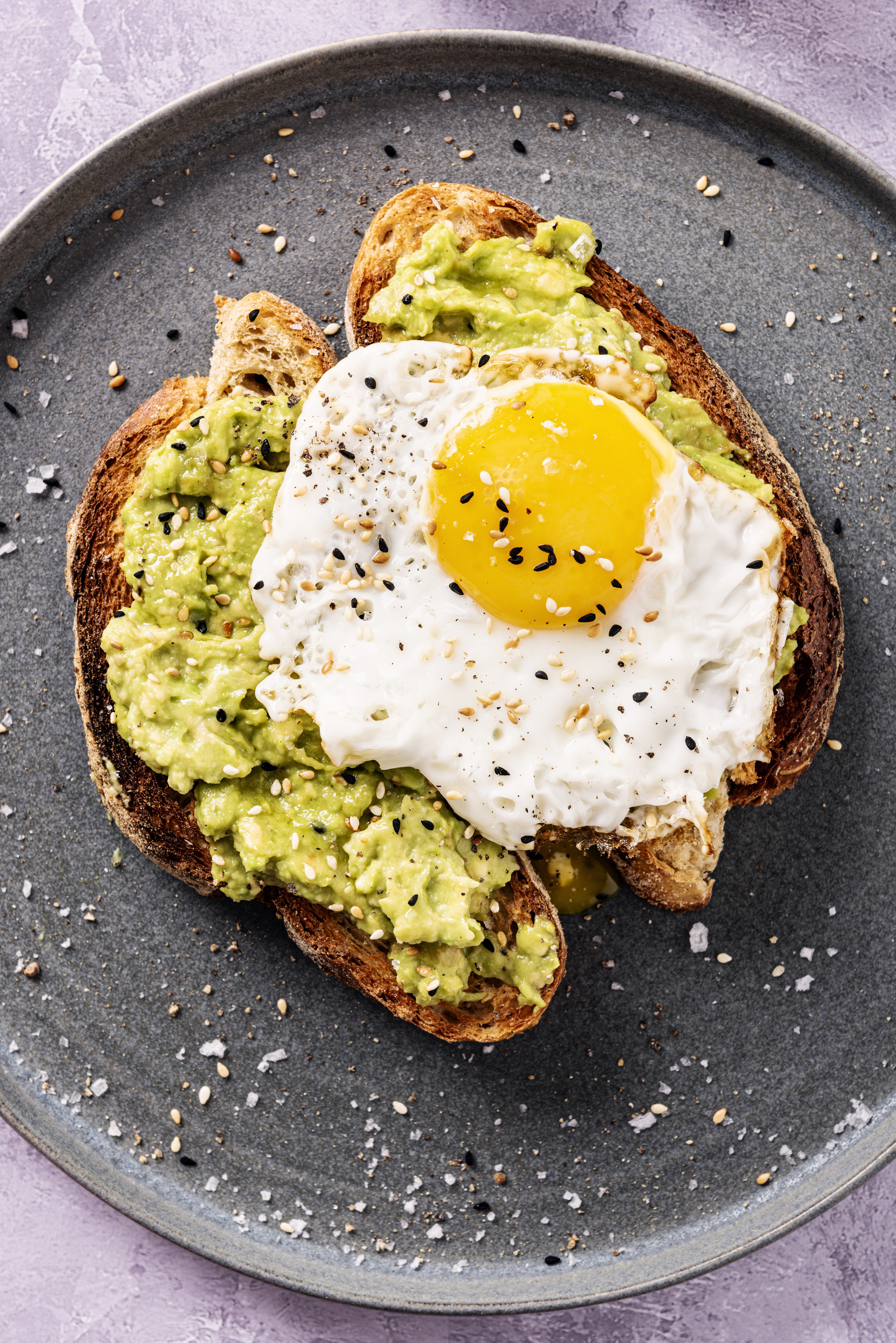 avocado toast topped with an egg