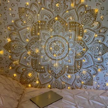 lights hanging against a tapestry