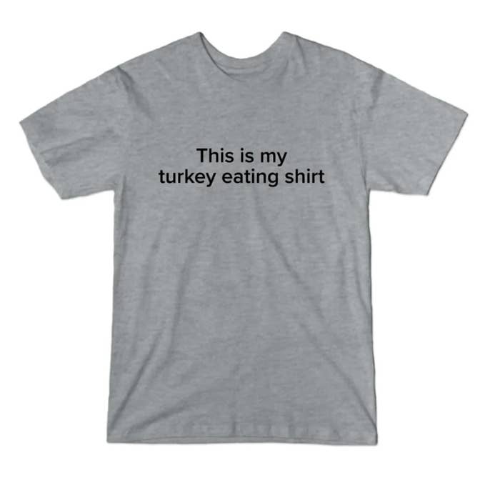 The heather gray short sleeve t-shirt with printed message "This is my turkey eating shirt"