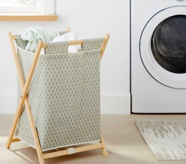 Laundry basket with towels in it