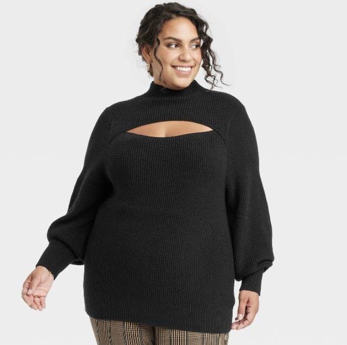 The model wears the cutout sweater in black