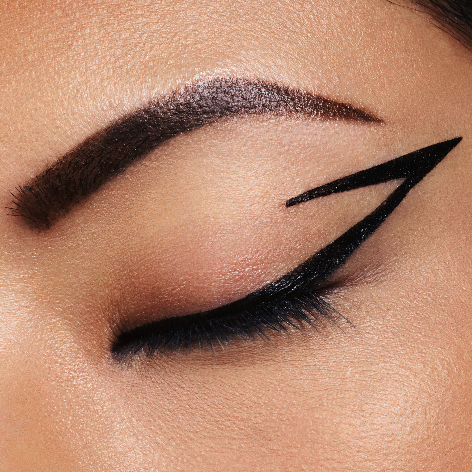 A person with bold eyeliner