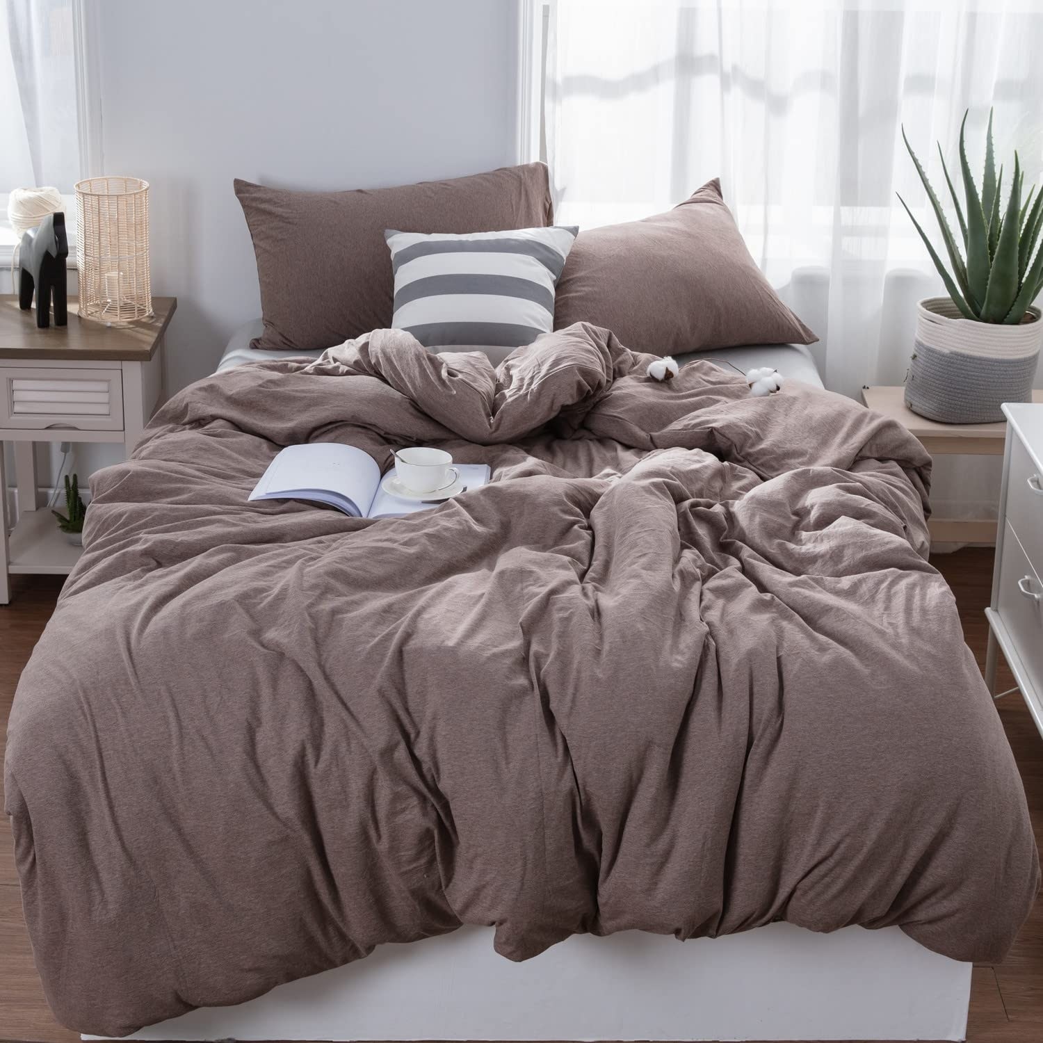 a stylish bed made up with the cotton jersey duvet cover and pillowcases