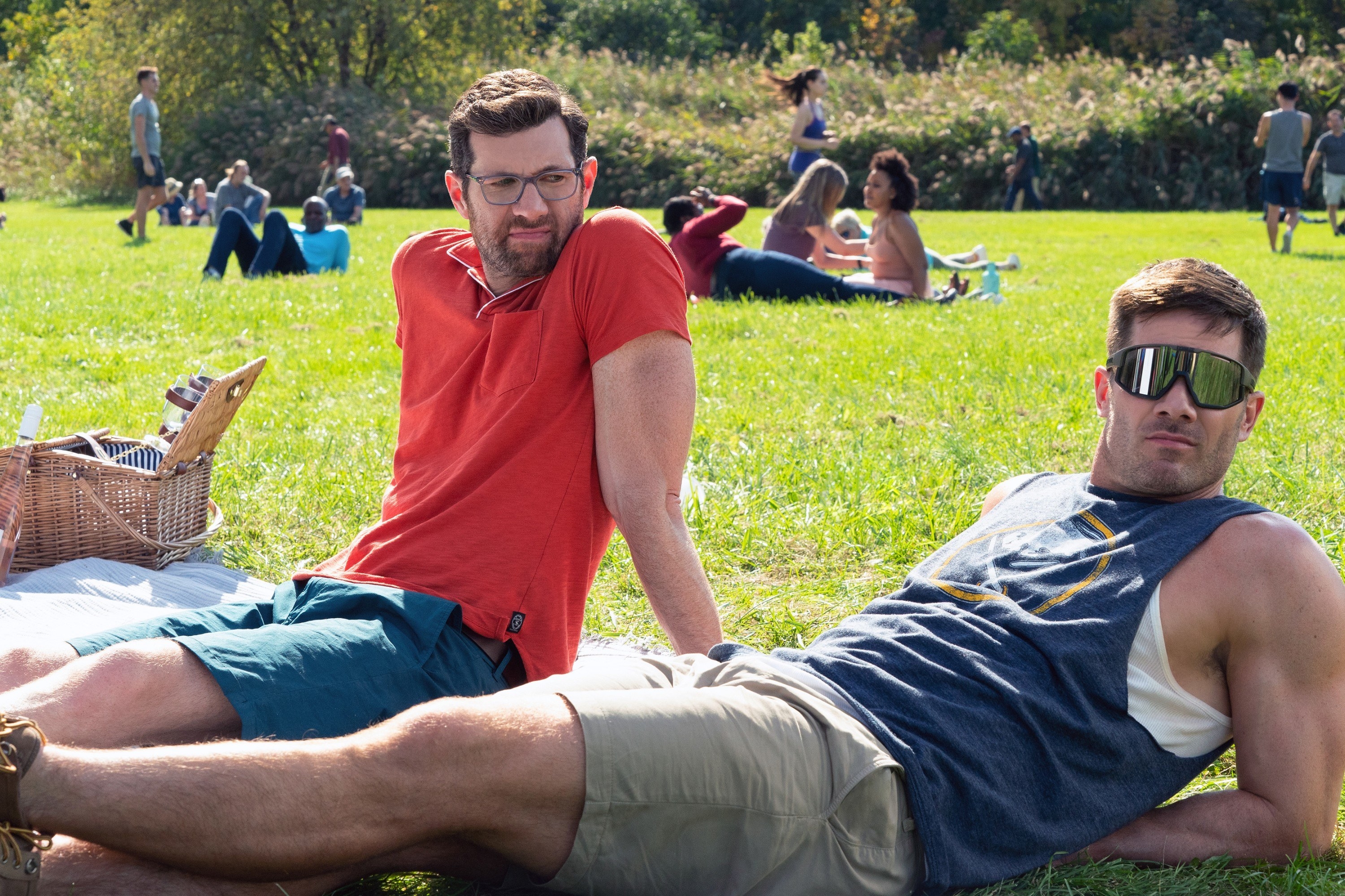 A screenshot from the movie sitting on a picnic blanket in the park