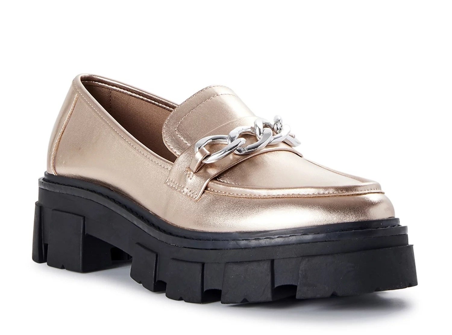 A pair of gold loafers with black lug sole