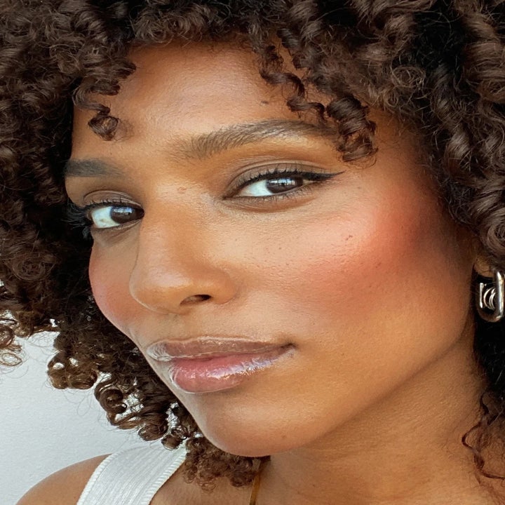 model wearing pink poppy colored blush