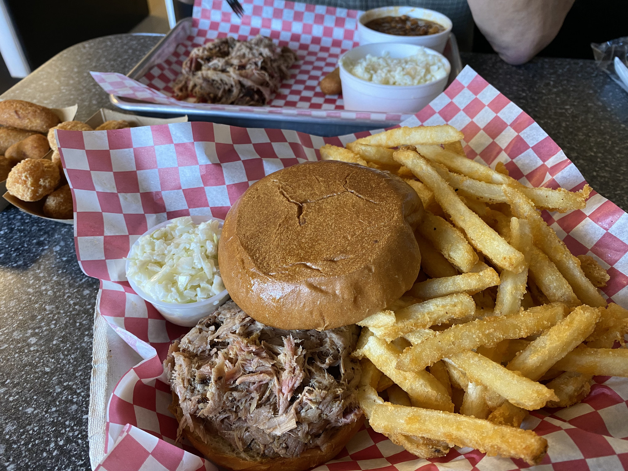 pulled pork sandwich, fries, and cole slaw