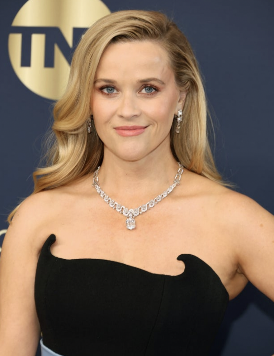 Reese Witherspoon in a black dress on a red carpet in 2022