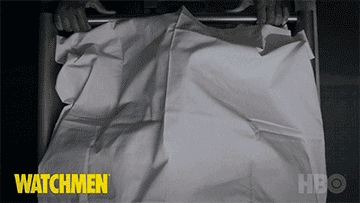 A corpse shown underneath a sheet