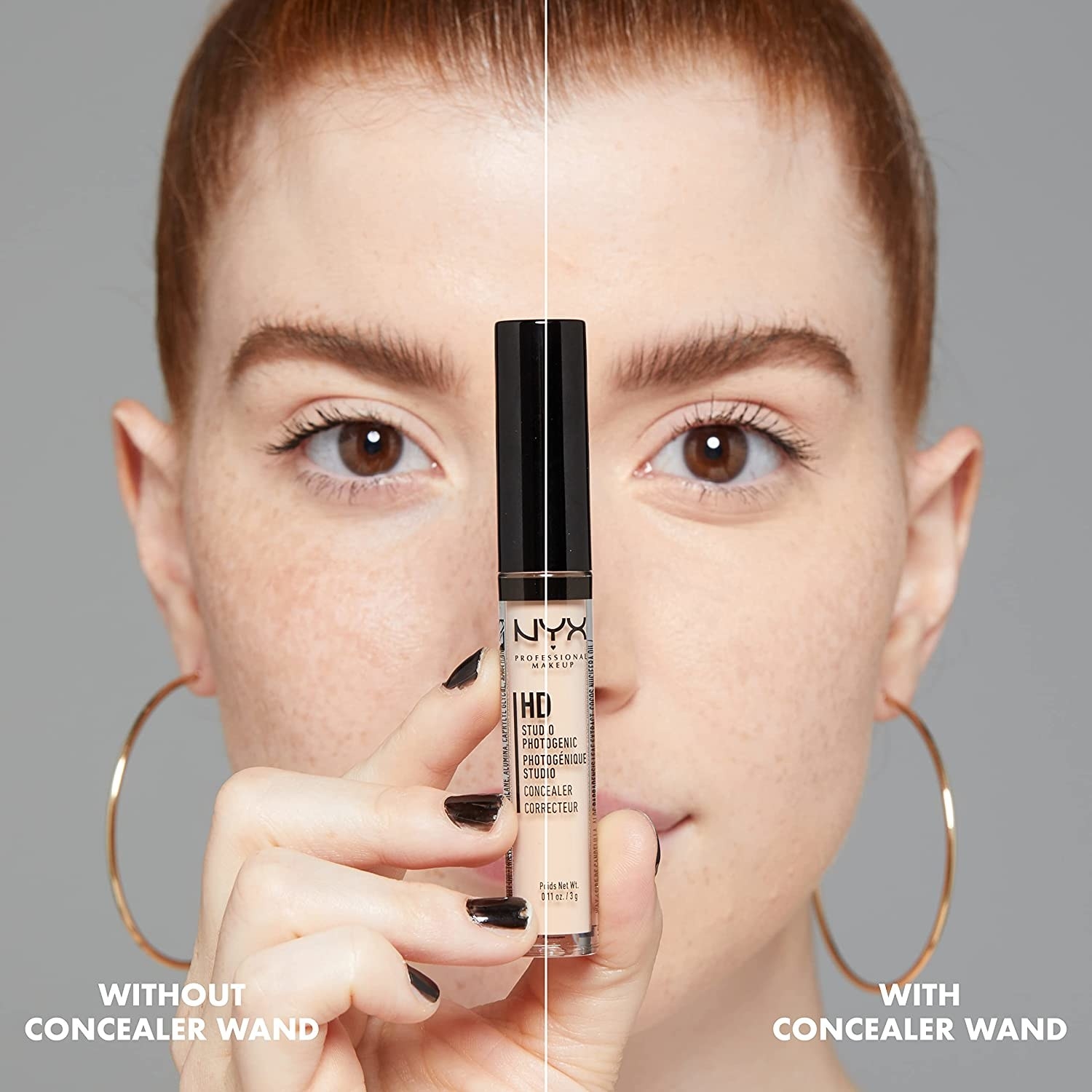 A person holding up a tube of concealer