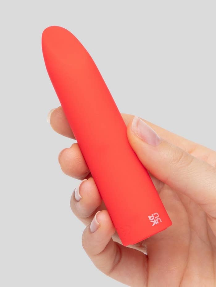 A hand holding the vibrator