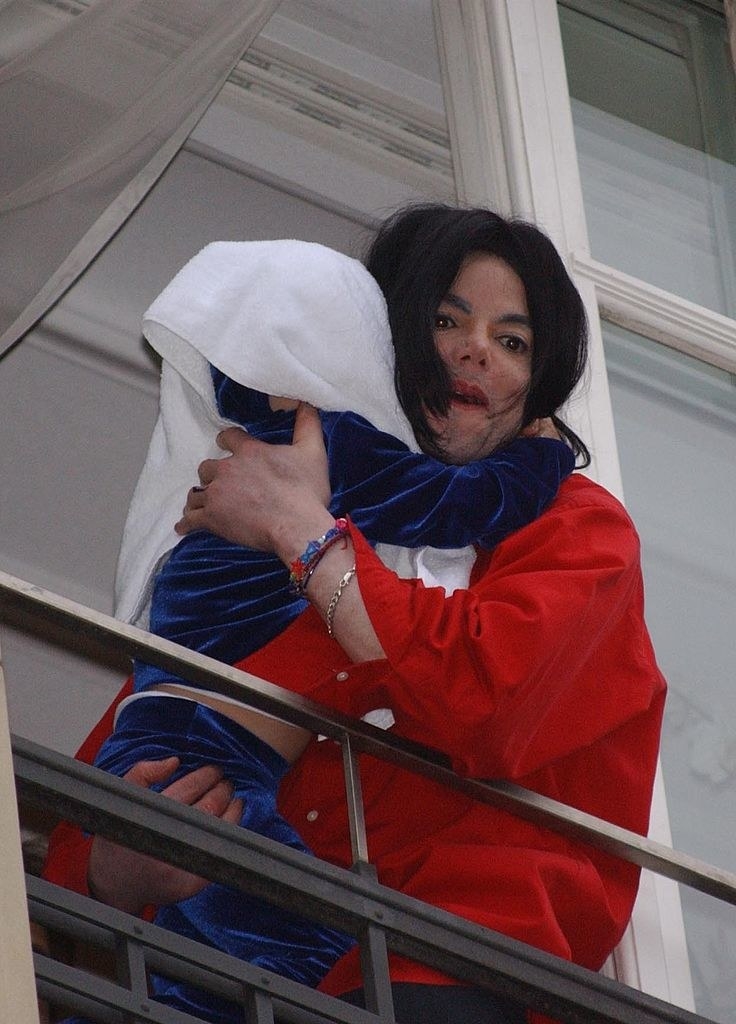Closeup of Michael Jackson holding his baby