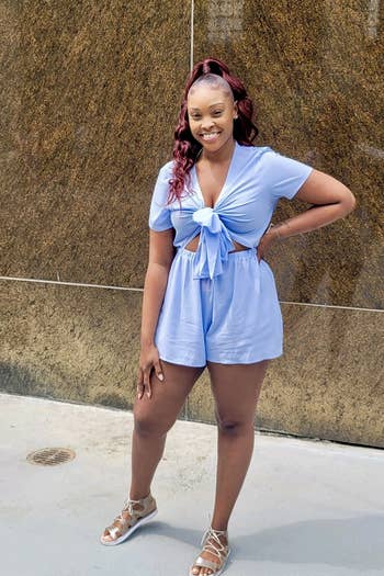 reviewer wearing the blue short-sleeve romper