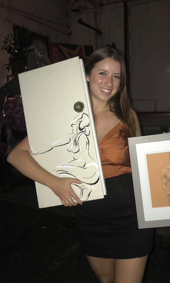 Audrey Berck holding artwork