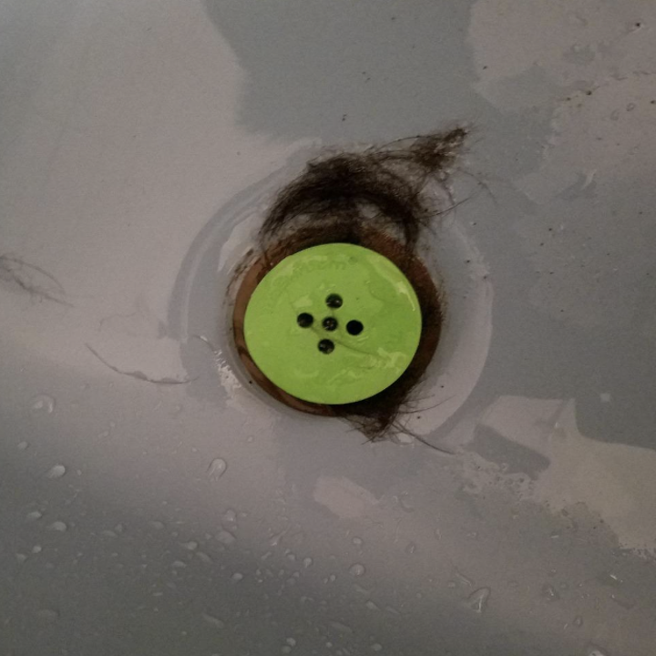 reviewer's tub shroom plugged in with hair stuck inside