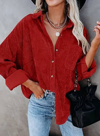 model in a red corduroy button down