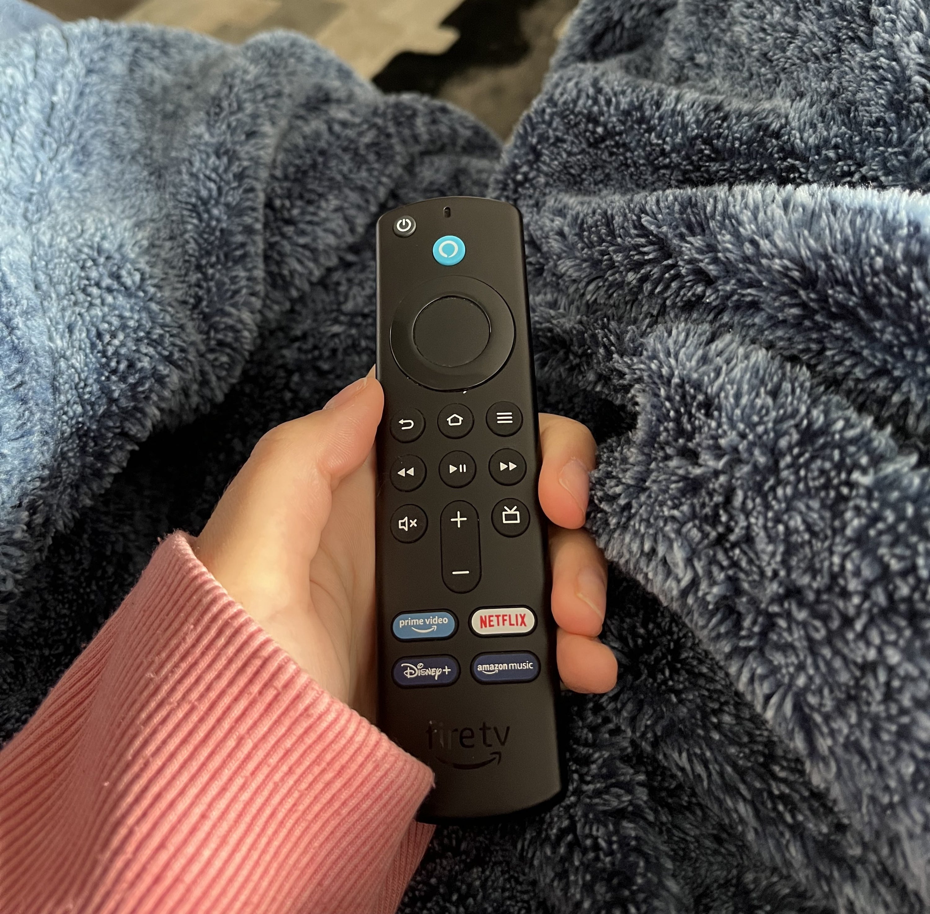 Melina holding the Fire TV Stick