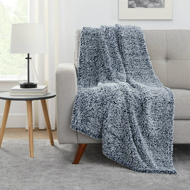 Slate gray throw blanket draped over a sofa