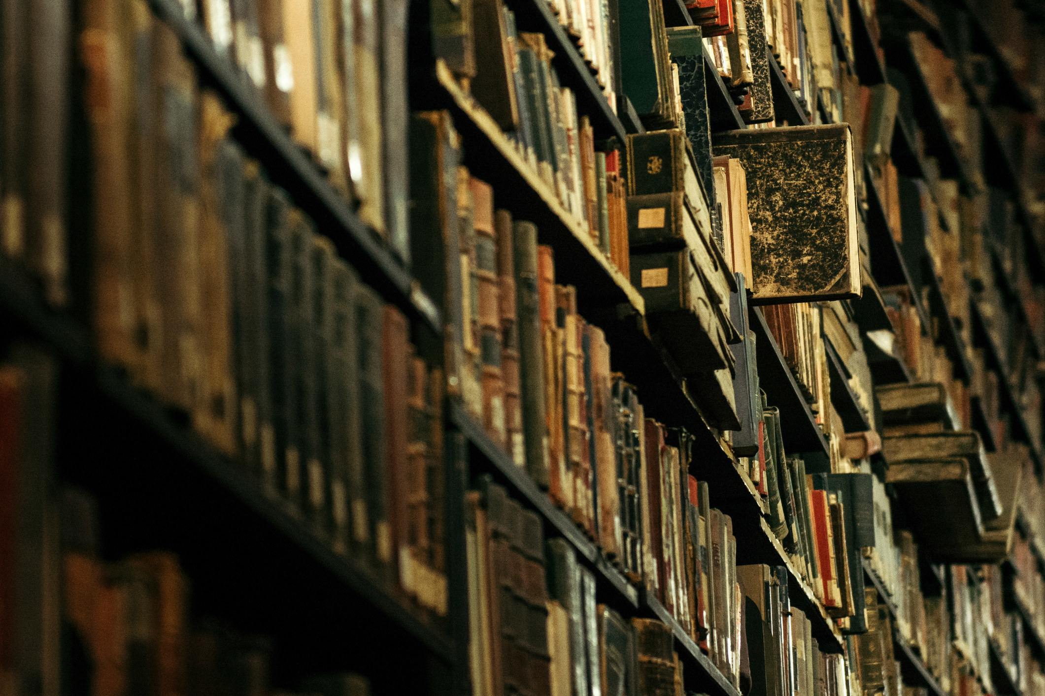 Stacks of old books in a library