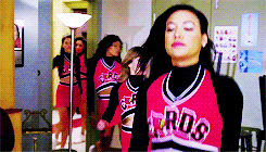 Naya Rivera flipping her hair in a cheerleading uniform in &#x27;Glee&#x27;