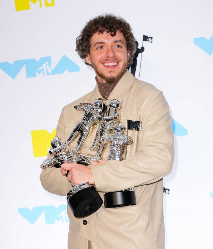 Closeup of Jack Harlow holding his MTV awards