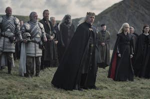 Viserys, Rhaenyra and the other characters stand at Aemma's funeral