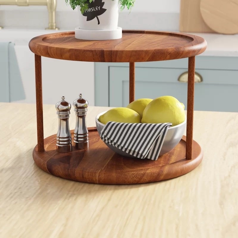 the wooden lazy Susan with parsley, lemons and salt and pepper shakers on it