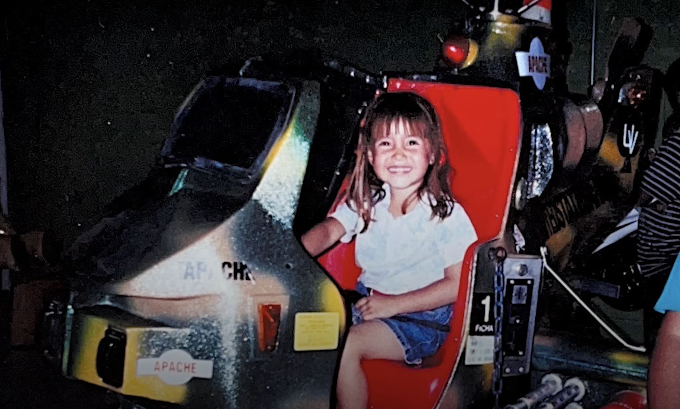 Kat as a little girl on a ride