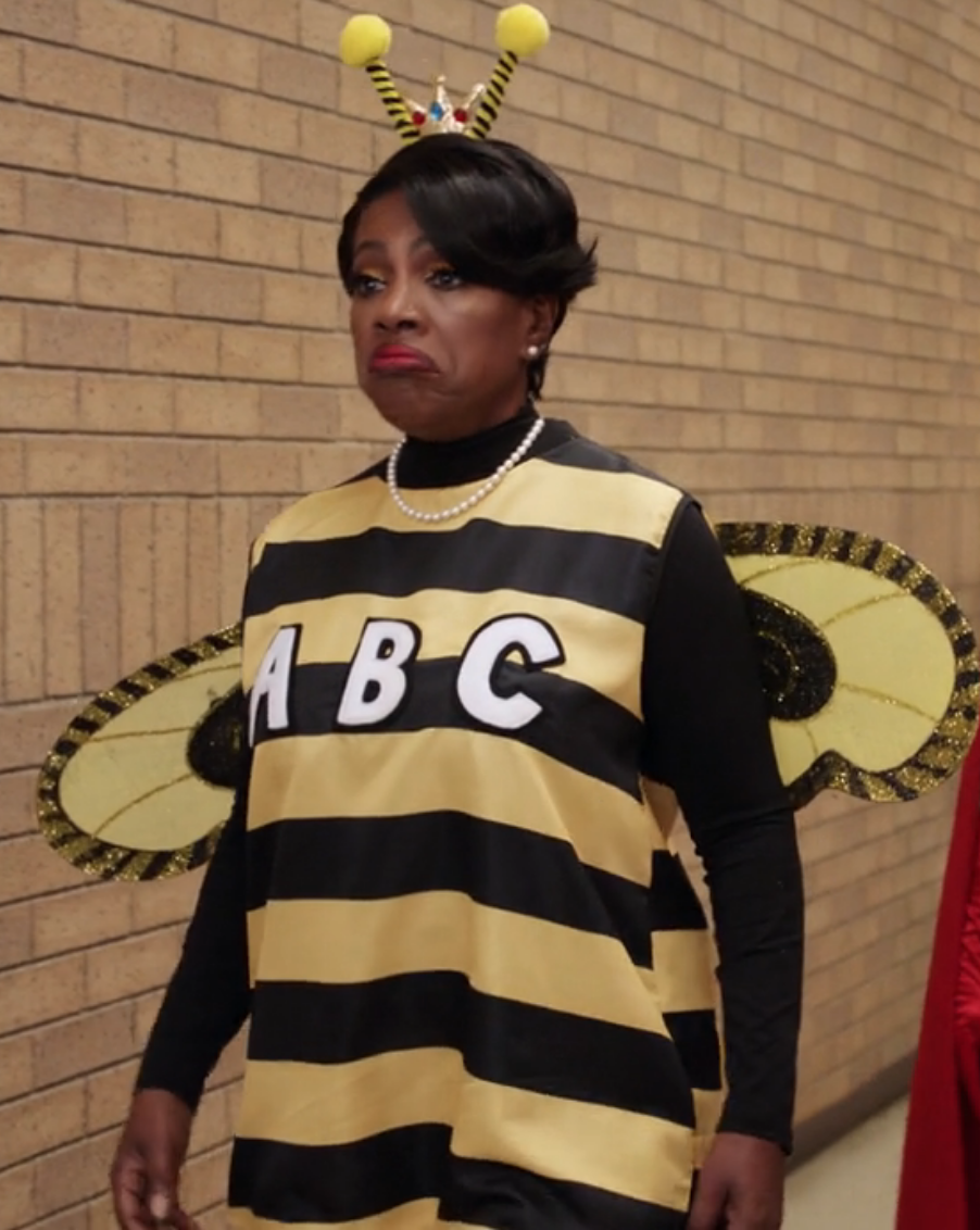 Barbara in a bee costume with wings with the letters &quot;A,B,C&quot; on the front