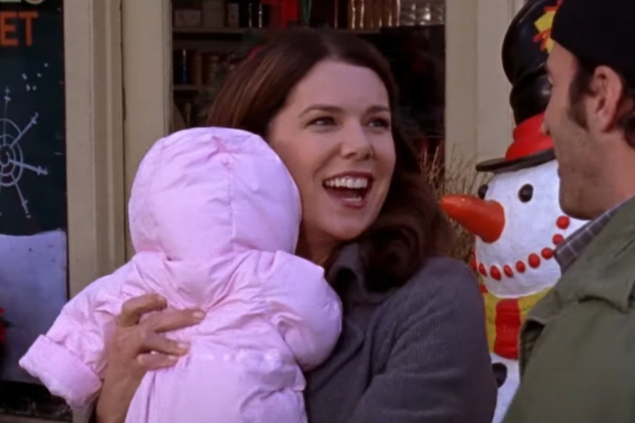 Lorelai from Gilmore Girls holding a baby