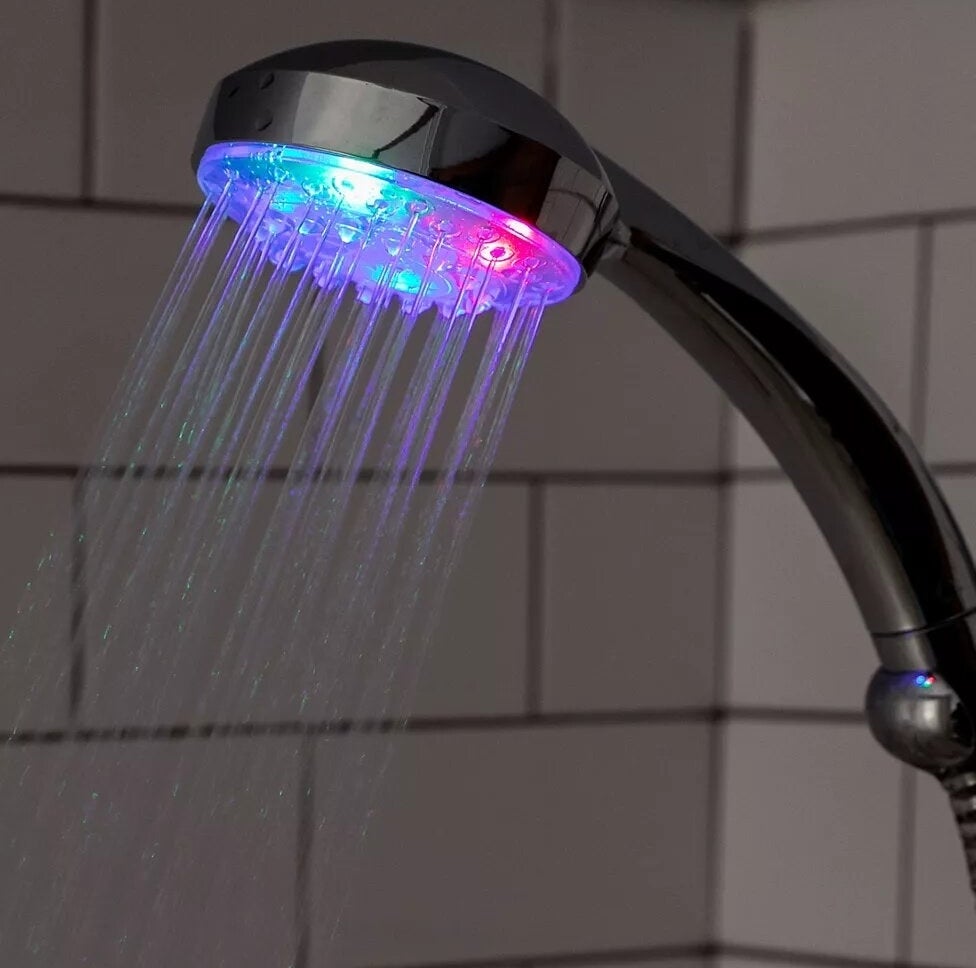 a showerhead with the LED light and water coming out
