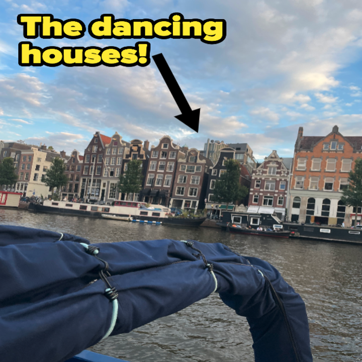 the canal with boats and dancing houses, text reads "the dancing houses"