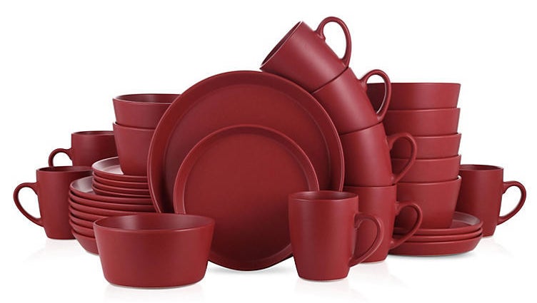 A set of red plates, bowls and cups