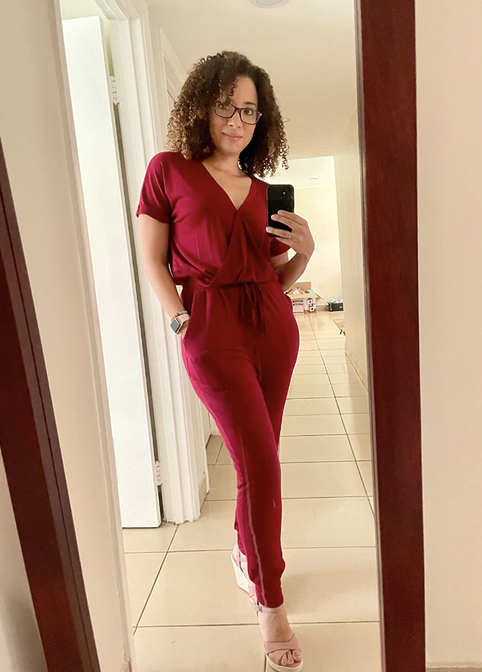 reviewer wearing jumpsuit in red
