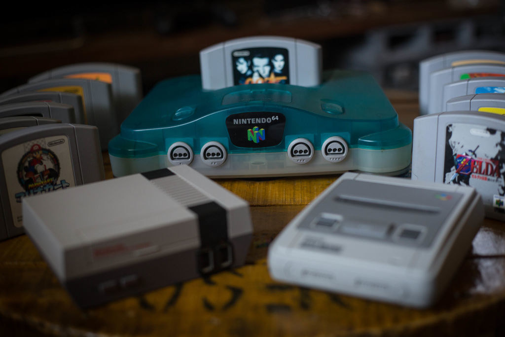 an array of various Nintendo game systems on a table