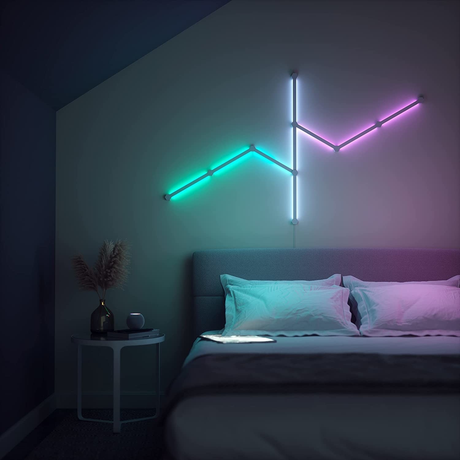 a nanoleaf light arranged on a wall above a bed