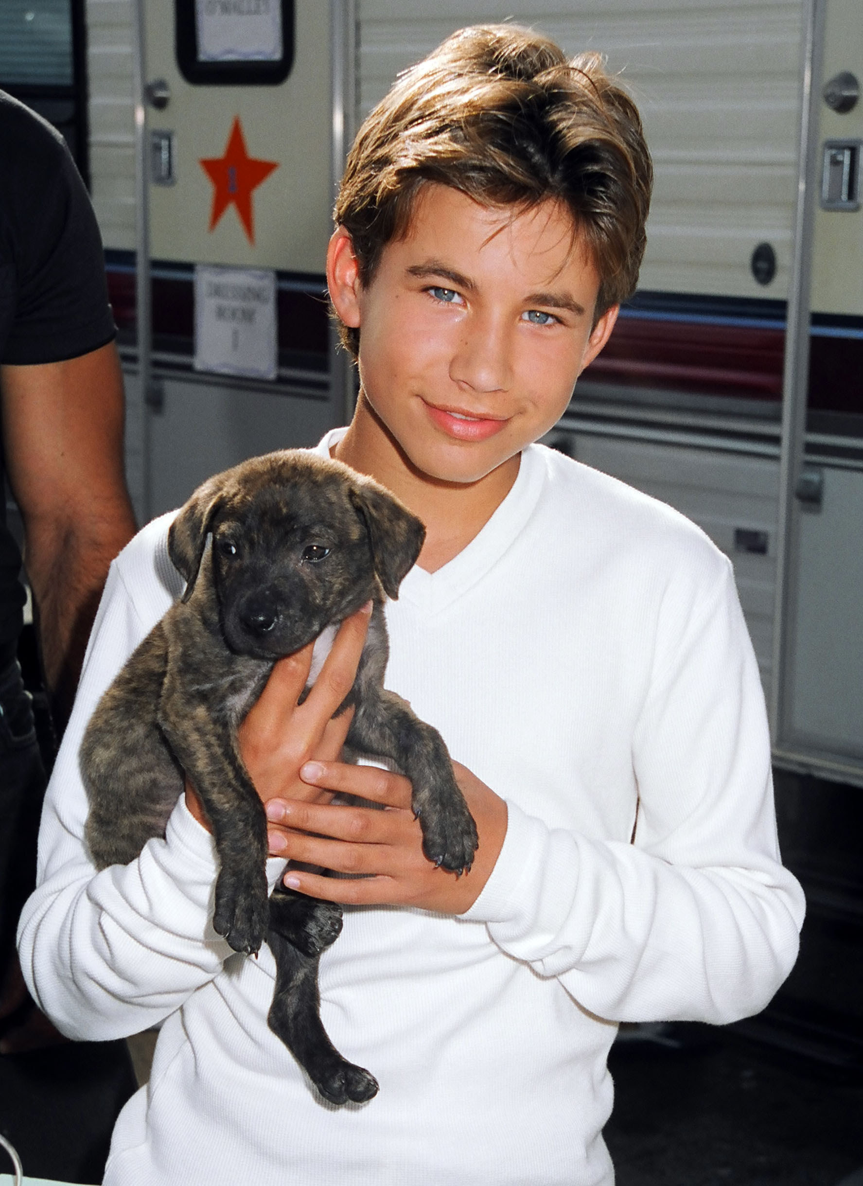 JTT holding a small dog