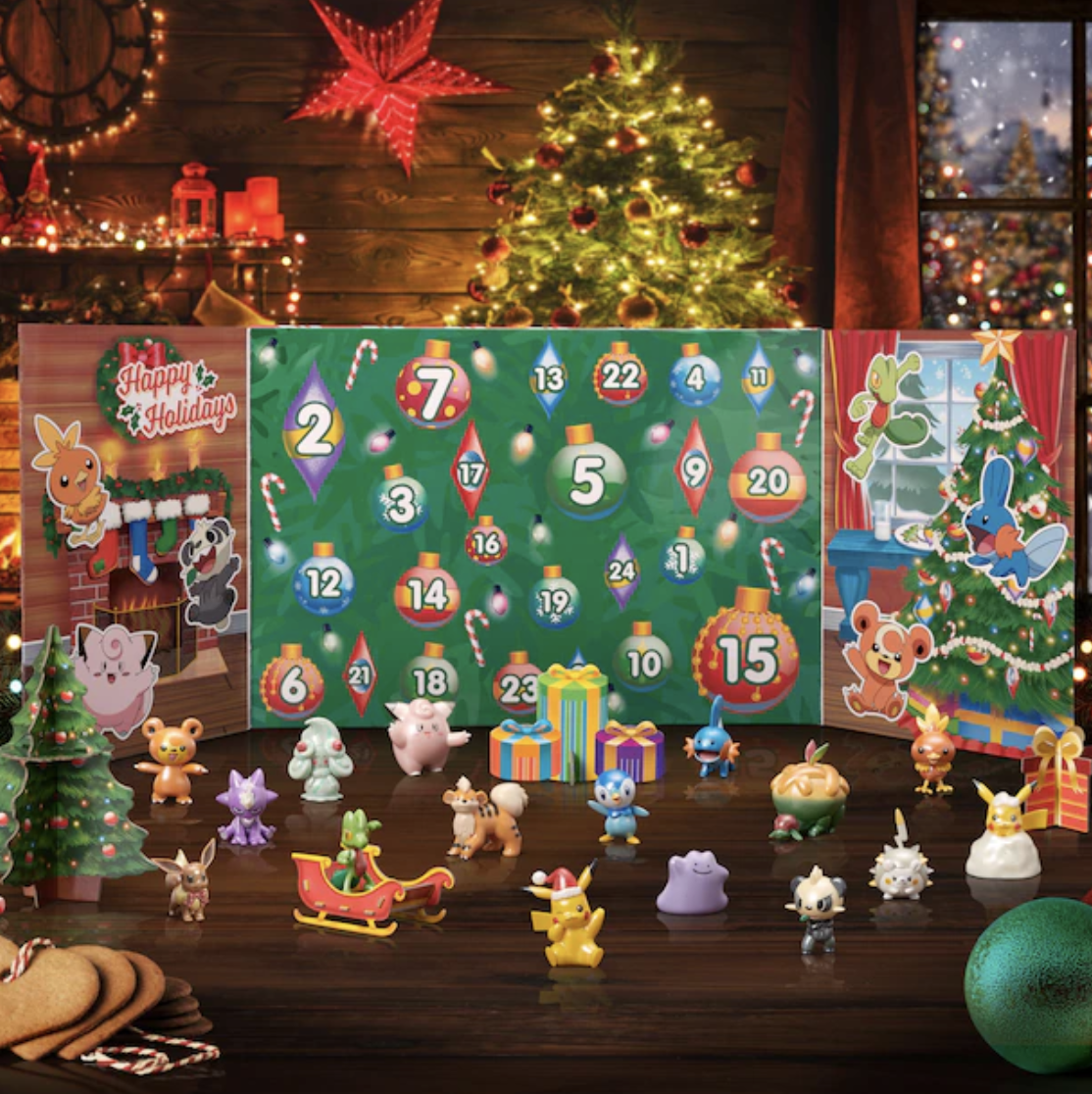 the advent calendar open with the figurines in front of it
