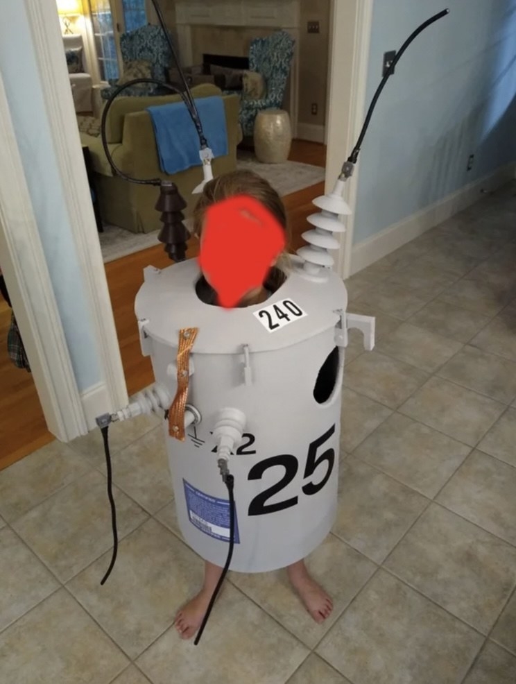 A kid dressed as a transformer