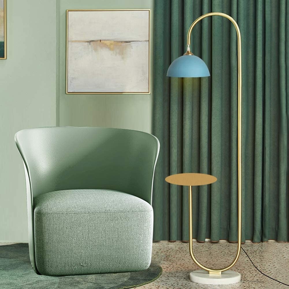 the blue lamp shade and gold stand floor lamp