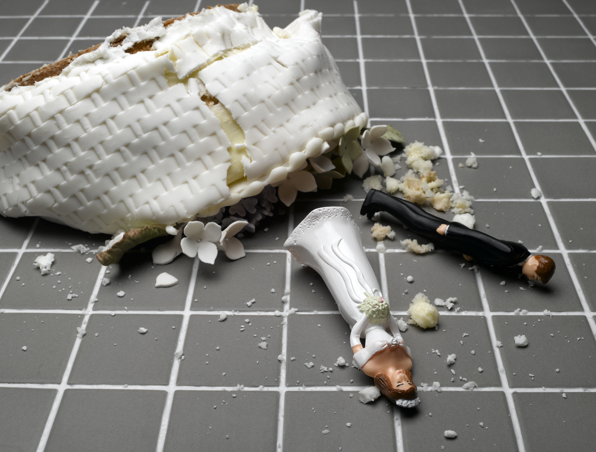a smashed wedding cake on the floor