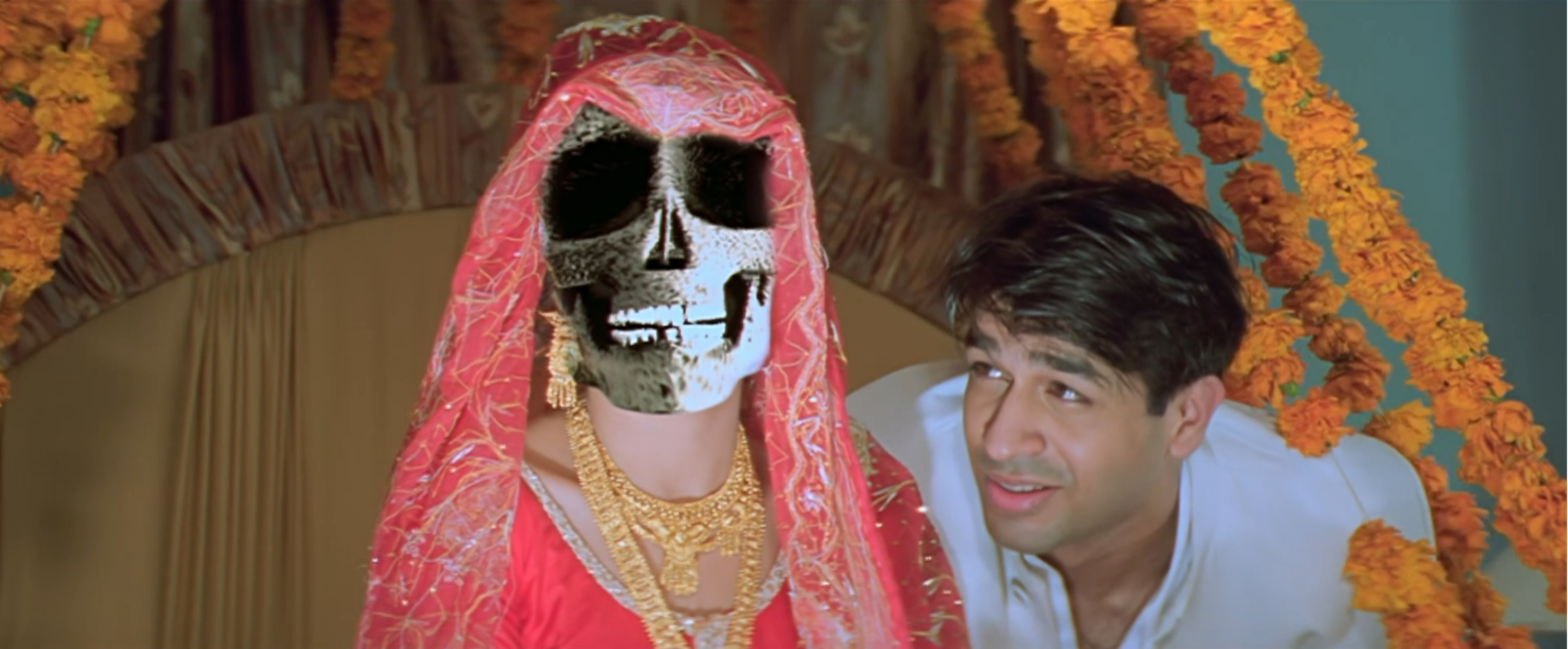 Rajat Bedi next to a woman who&#x27;s face appears to be a skull