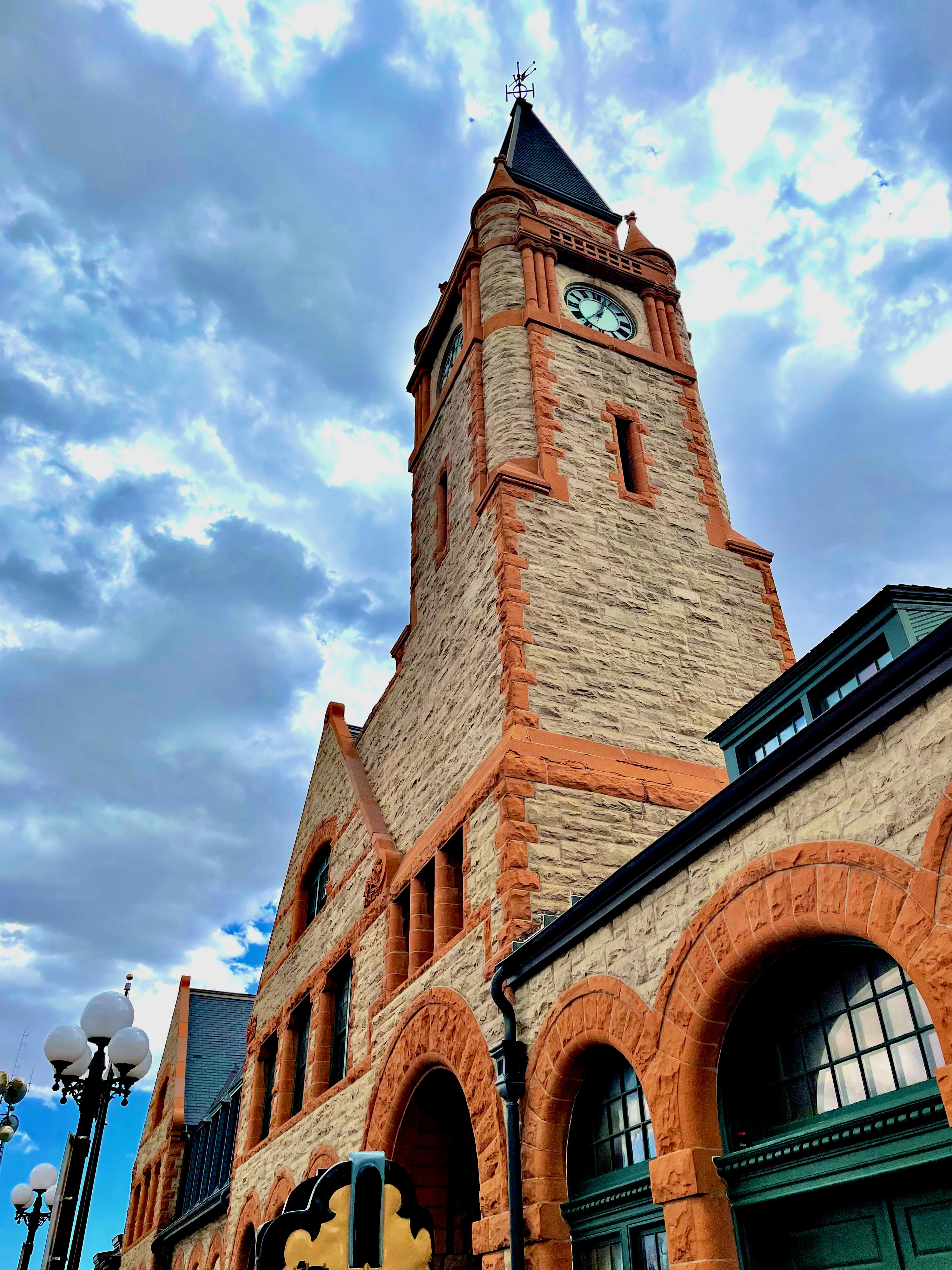 The steeple of an old brick building